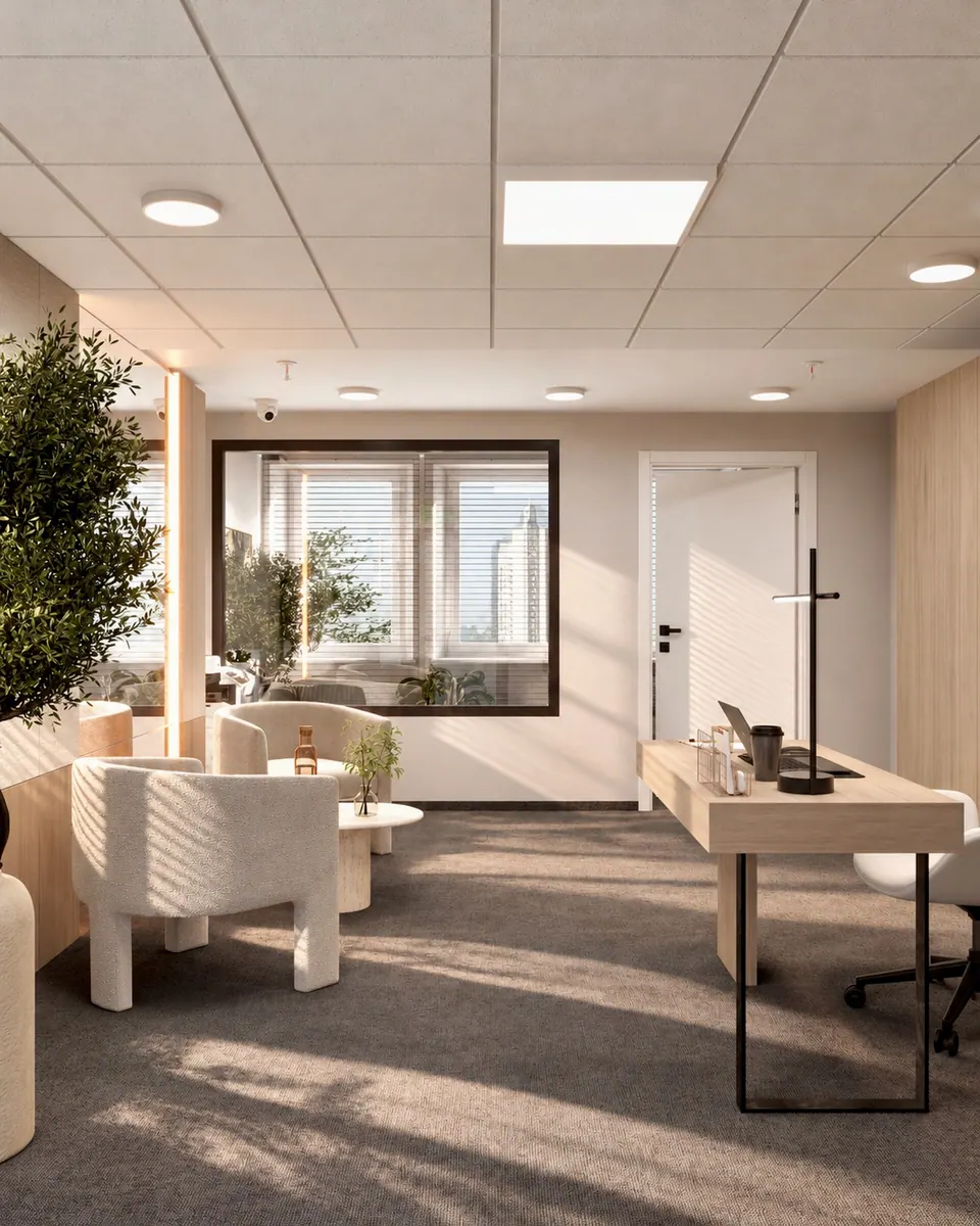Office reception with a front desk, armchairs and a coffee table