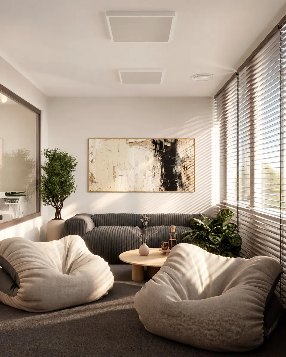 Lounge with a sofa, bean bag chairs and a painting