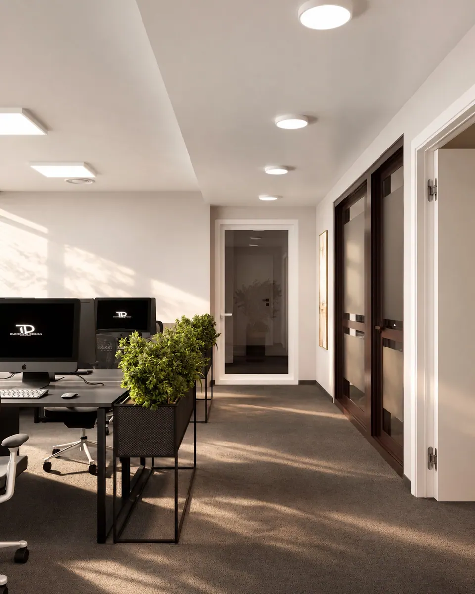Office with dark desks by a glazed door