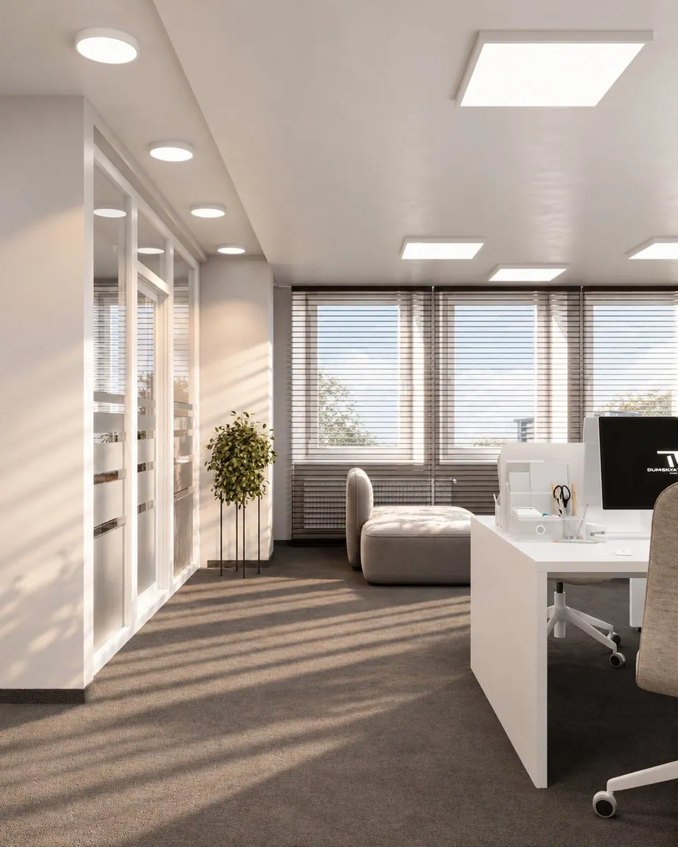 White desks behind a glass partition